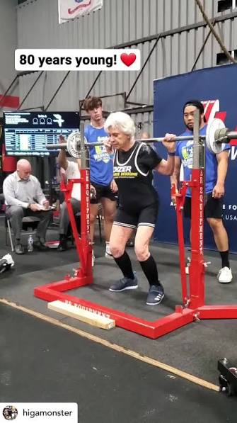 Lifter in her eighties squatting at a powerlifting meet